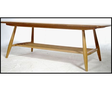 A vintage 20th century Ercol ' Windsor ' light elm and beech finish rectangular coffee table with fitted slatted undertier, r