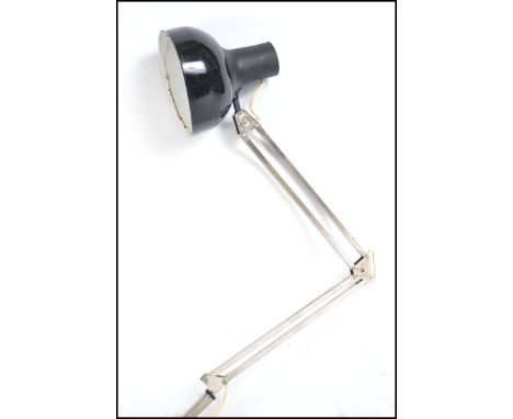 A vintage 20th century retro industrial Finnish LIVAL anglepoise lamp having a black pendant shade and chrome body with clamp