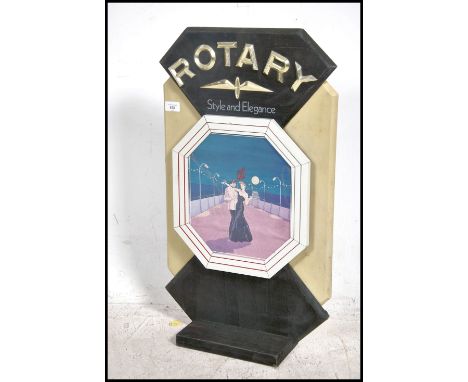A 1970's Rotary shop advertising sign in the Art Deco style. Pictorial panel centre with geometric shaped upright stand with 