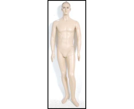 A large 20th century full sized shop tailors haberdashery mannequin of a man ( see illustration ).&nbsp;Measures height 187cm