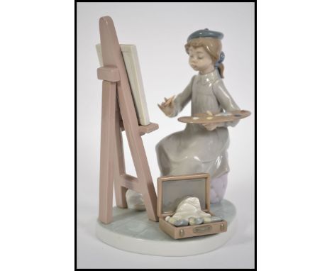 A Lladro seated figurine of a girl painting / artist complete with easel and box of paints being marked to the base for Lllad