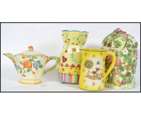 A collection of ceramic items to include an Art Deco hand painted Beswick teapot, milk jug, biscuit barrel and vase. Please s