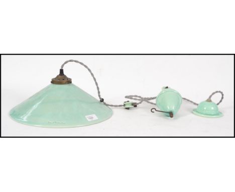 A ceramic rise and fall teal coloured ceramic pendant electric light stamped with ' Terre d' Hautaniboul '. The shade 13'' di