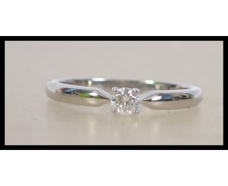 A ladies decorative 18ct white gold single stone diamond ring approx 25pnts 2.6 grams measures Q.