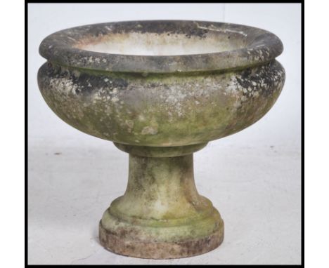 A large campana marble urn raised on square plinth base having urn top of circular form with waisted centre - Garden planter