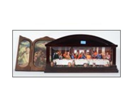 A wooden tryptych opening to reveal ceramic religious panels depicting the birth of christ by BradEx. Together with a wall mo