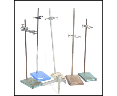 A collection of vintage 20th century school / industrial science labs metal stands many of which having a cast bases.