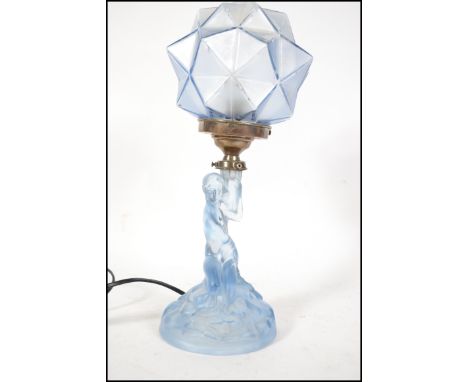 A vintage Art Deco blue frosted glass table lamp in the form of a lady, with a domed geometric form frosted blue glass shade.