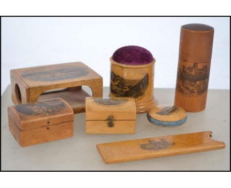 A collection of vintage treen worked mauchline ware to include a pin cushion pot  with Lantern Island & Capstone Hill Parade 