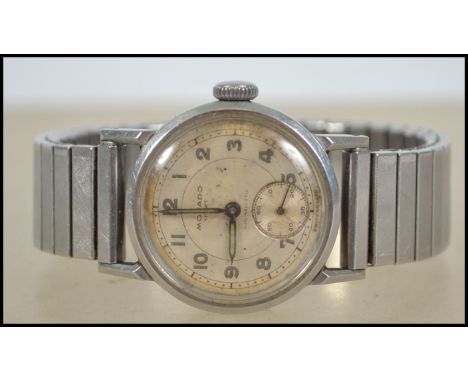 A vintage first half of the 20th century gents Movado wrist watch the signed circular silvered dial with gilt Arabic numerals