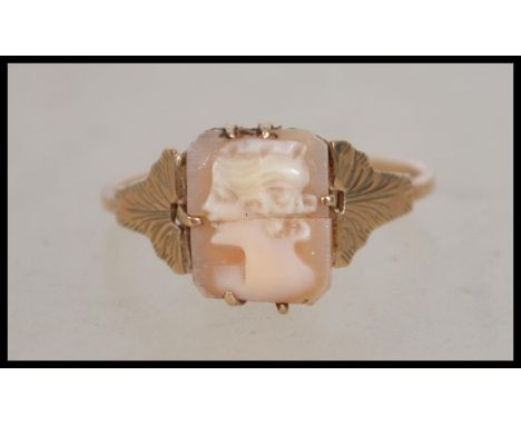 A 9ct gold early 20th century cameo ring with acanthus leaf shoulders. Size P. Weight 1.6