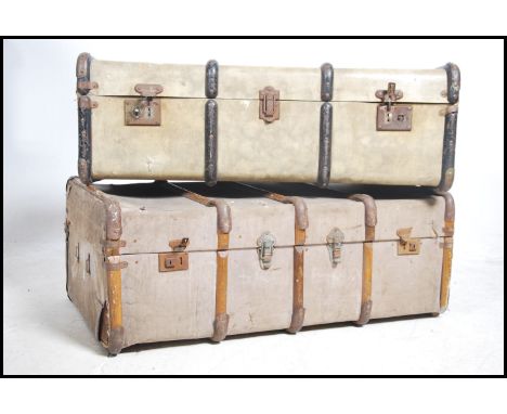2 vintage early 20th century canvas and wooden bound steamer trunks - ideal as coffee table conversions. Both with clasps to 