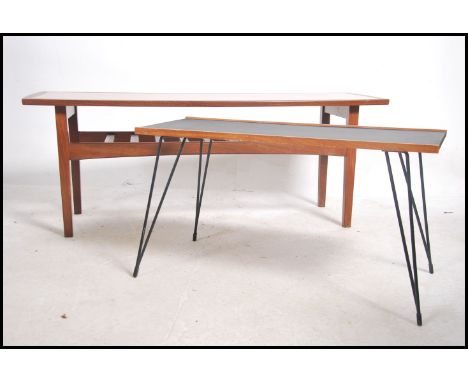 A vintage mid century &nbsp;teak wood Danish influence coffee table complete with magazine rack and teak edging together with