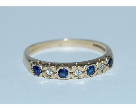 A hallmarked 9ct gold blue sapphire and diamond half eternity ring. Hallmarked Birmingham. Weight 2g. Size