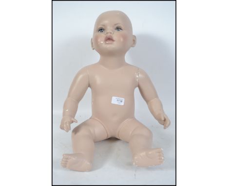 A 20th century &nbsp;small child / baby mannequin having jointed limbs.