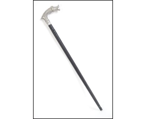 An unusual 20th century silver white metal fish topped sword stick / swagger stick of small proportions. Measures 58cm long.