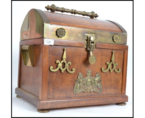 A stunning dome top mahogany chest top trunk, the hinged lid opening to reveal drawers to the inner and false bottom. Carry h