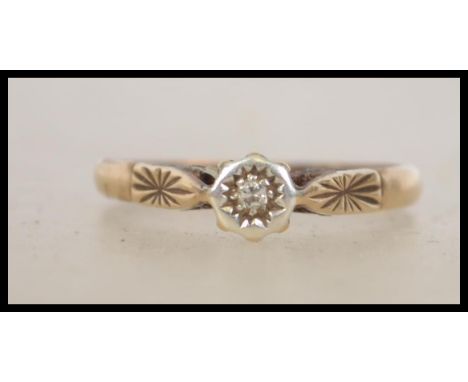 A 9ct gold / 375 hallmarked ladies diamond ring having single stone to star setting approx 2 pnts. Total weight 2.4g