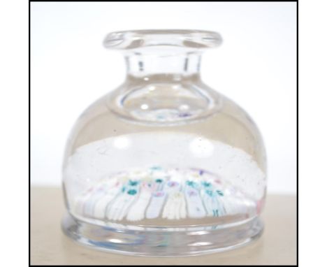 A 19th century millefiori caneworked paperweight inkwell having waisted neck ( no stopper ) measuring 8cms high 