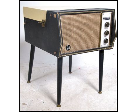 A vintage 1950's Dansette Hi-Fi model record player complete with the dansette tapering legs having 2 tone colour body with i