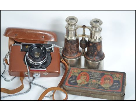 A vintage Yashika ' J ' camera complete with lens in brown leather case together with a pair of white metal and leather binoc