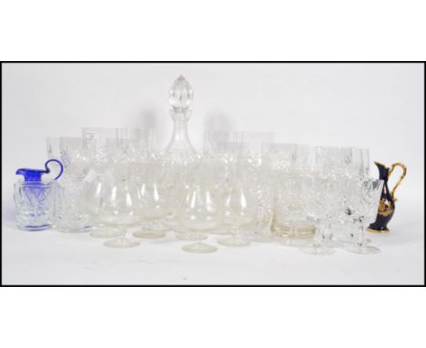 A good collection of cut glass to include decanter and 6 wine glasses, brandy and sherry glasses, large cut glass wine goblet