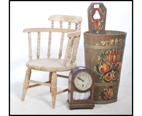 A Victorian childs smokers bow armchair raised on turned legs together with a tollware painted bread bin and an Edwardian man