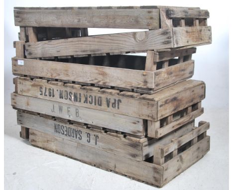 A stack of vintage Industrial apple crates. Wooden planked form with remains of paint and notation to some ( see illustration