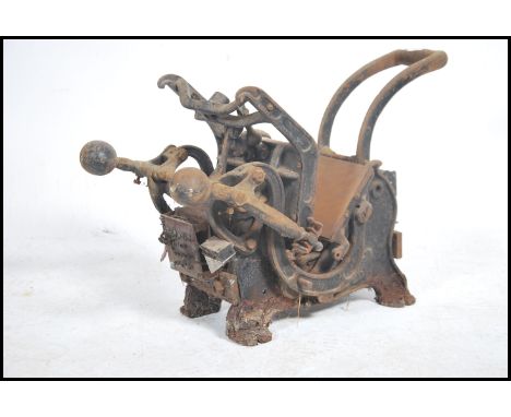 An early 20th century cast iron table / bench top printing press by Model having notation to centre.&nbsp;Measures height 95c