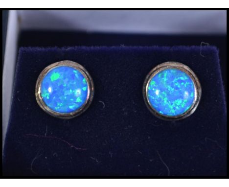 A pair of silver and blue opal ladies stud earrings complete with posts and in the original presentation &nbsp;box