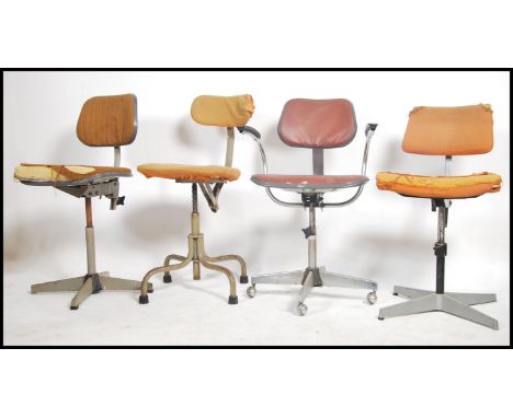 A vintage 1950's Air Ministry office swivel chair on tubular metal frame being stamped to the underside of the chair together