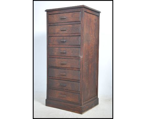 A vintage 20th century dark stained straight eight pine chest of drawers raised on a plinth base.&nbsp;Measures height 122cm 