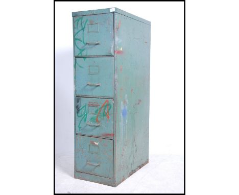 A vintage retro 20th century four drawer industrial filing cabinet retaining original distressed paint.&nbsp;Measures height 