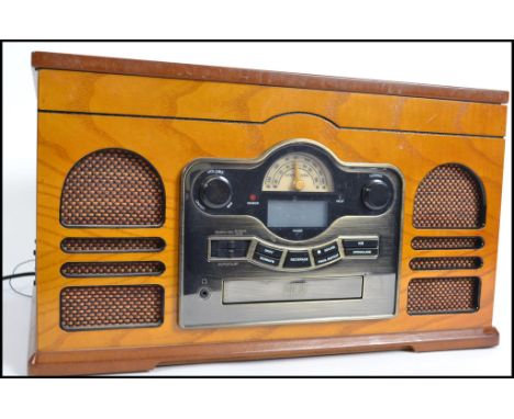 A retro style wooden cased hi-fi system by Stoford having record deck, radio and Cd player etc