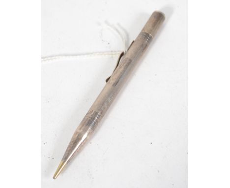 A sterling silver propelling pencil, having an engine turned design and marked sterling silver.