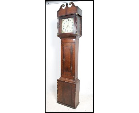 A 19th century believed Welsh longcase / grandfather clock with painted face being set within an oak case, trunk and hood com