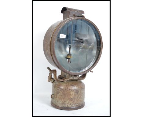 A vintage industrial 1930s RAF WWII Tilley floodlight projection lamp, used for emergency air field lighting, being kerosene 