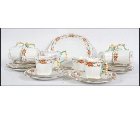 A Royal Stafford chintz pattern porcelain tea service comprising cups, saucers, plates, creamer and sugar bowl etc