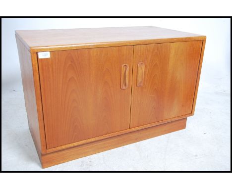 A vintage mid century G-Plan teak long and low sideboard in the Fresco design comprising of double cupboard doors opening to 