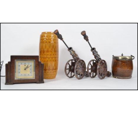 A retro West German fat lava pot together with a pair of fireside pokers in the form of cannons, an electric mantle clock etc