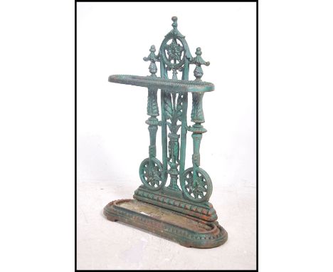 An early 20th century &nbsp;cast iron painted stick stand, having Coalbrookdate type decoration with fitted tray to base. Mea