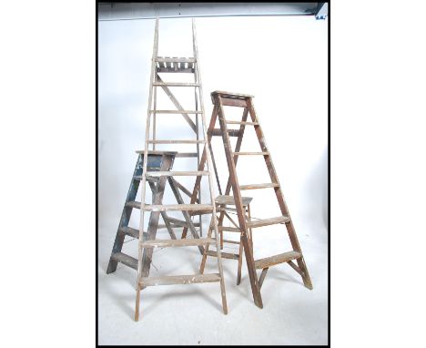 2 large 20th century vintage wooden ladders of folding form together with another 2 smaller vintage Industrial wooden workers