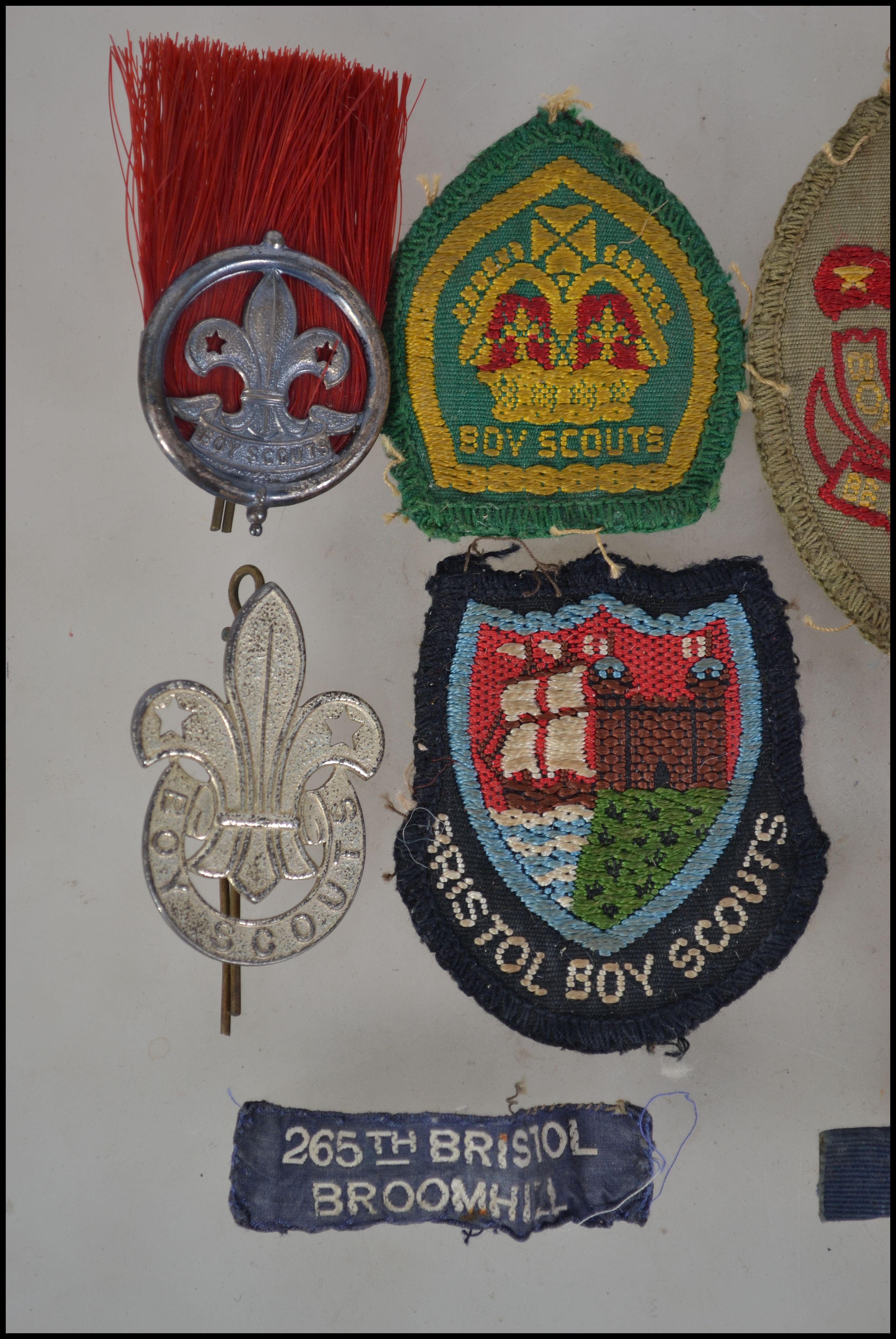 A collection of vintage Boy Scouts badges and patches to include