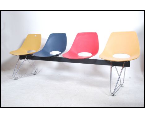 A contemporary Charles &amp; Ray Eames style 4 seat bench by Merryfair having chrome DSW style eiffel supports with multicolo