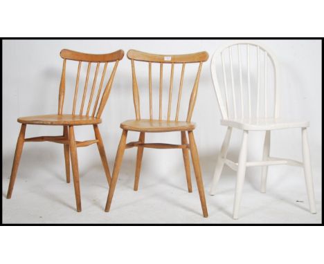 A pair of vintage / retro Windsor spindle back elm and beech Ercol dining chairs together with another Ercol dining chair.&nb