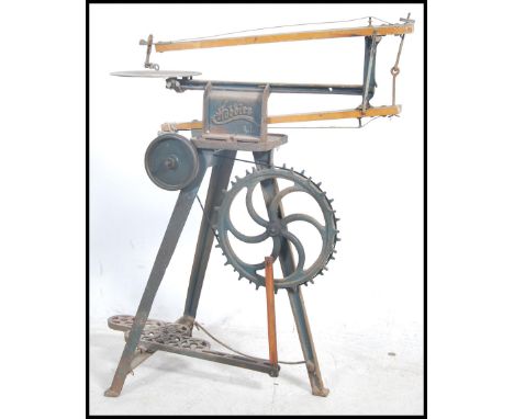 A vintage mid century Hobbies jigsaw lathe tool with foot pedal action and metal frame construction. Measures height 84cm x w