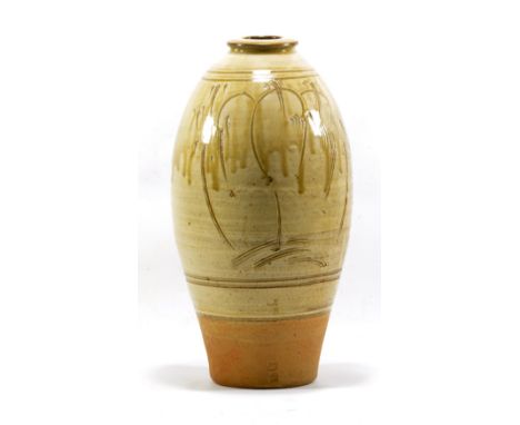 JIM MALONE (born 1946); a tall stoneware vase, running green ash glaze and incised decoration to upper two-thirds, impressed 