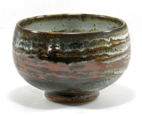 JOHN LEACH (born 1939) for Muchelney Pottery; a stoneware footed bowl, dolomite and tenmoku glaze, impressed JHL and pottery 