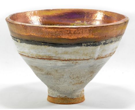 ROBIN WELCH (born 1936); a deep stoneware footed bowl, white glaze with bands of black and ochre and gold lustre to rim, impr