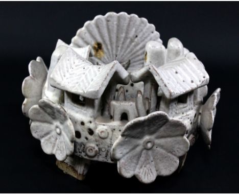 IAN GODFREY (1942-1992); a stoneware sculpture of a village with characteristic donkeys and applied flowers to ring, dry matt
